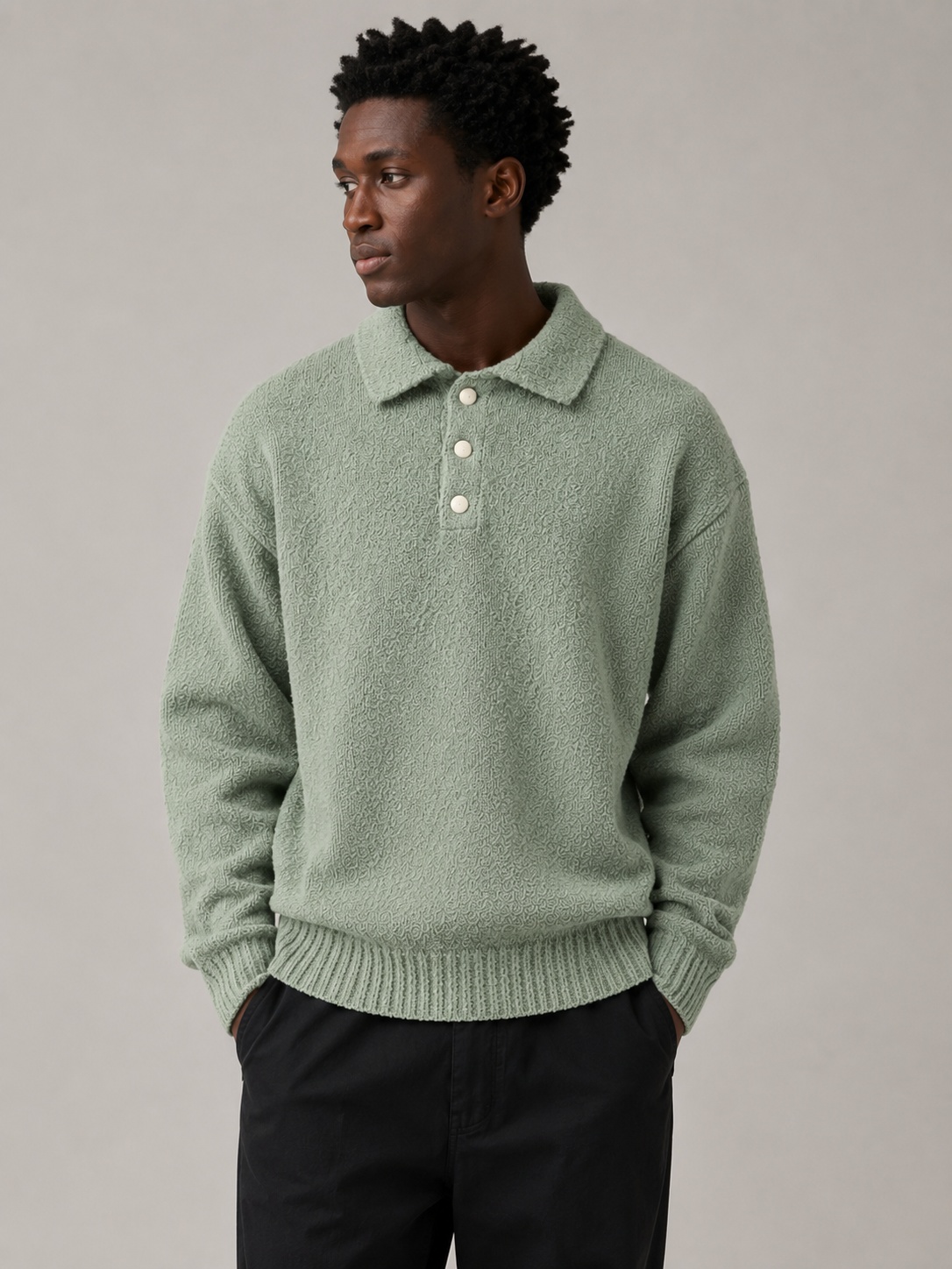 Professional Black male model wearing the Moss Knit Sweater — front view