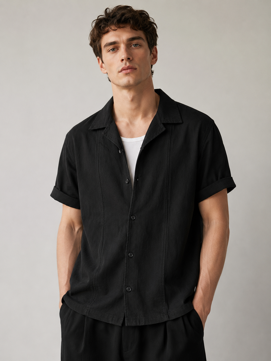 Black textured Artisan Stitch short-sleeve shirt styled on a male model