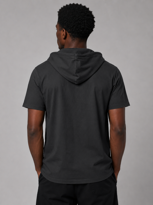 Black short-sleeve hooded Coastline shirt styled on a male model, back view