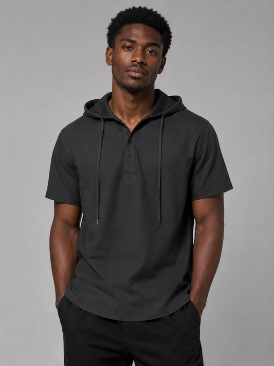 Black short-sleeve hooded Coastline shirt styled on a male model, front view