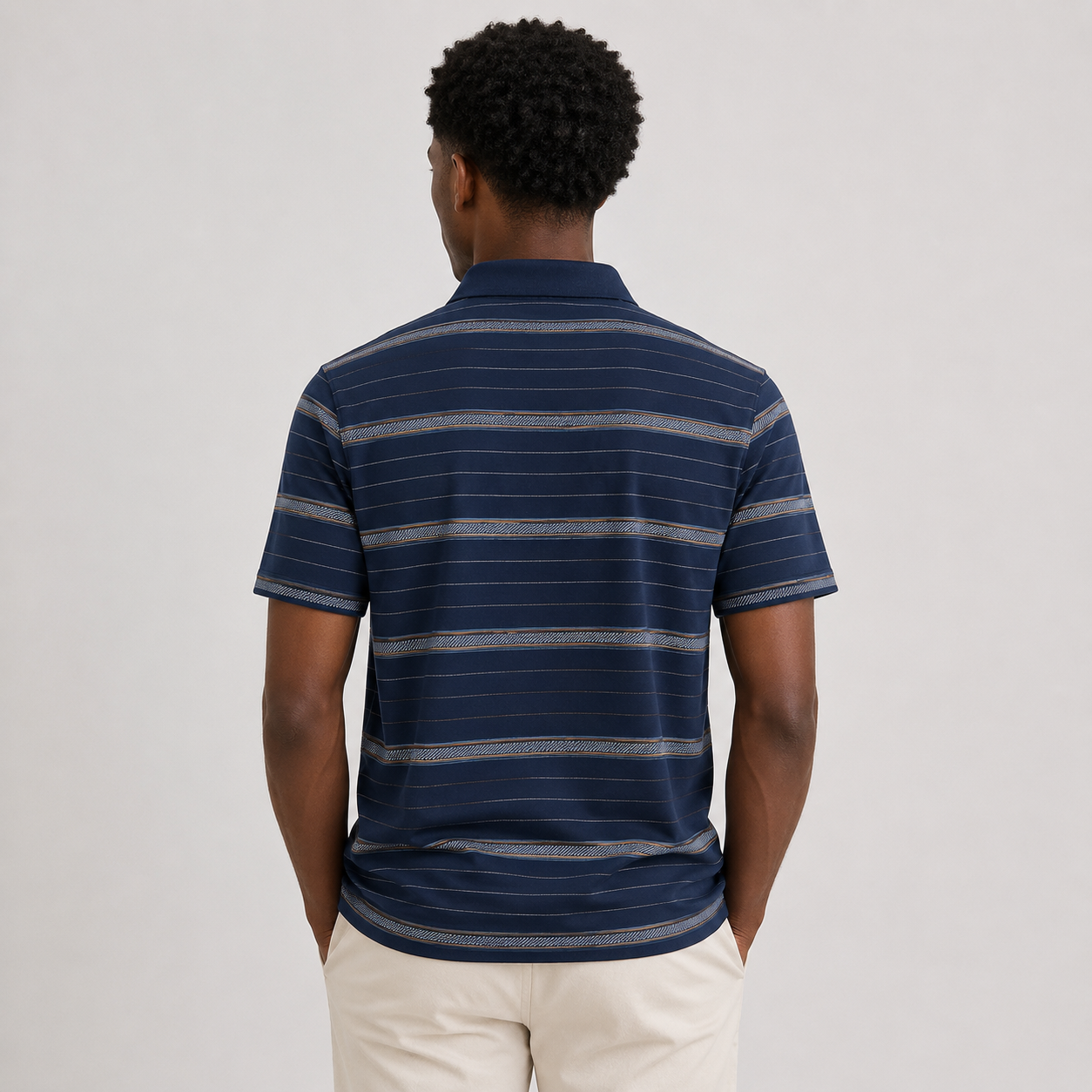 Navy Blue Corsica Striped Polo Tee styled on a male model, back view