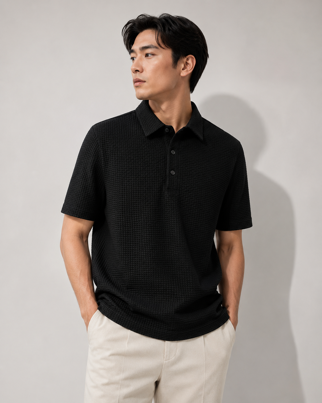 Black Drape Luxe Tee styled on a male model, front view
