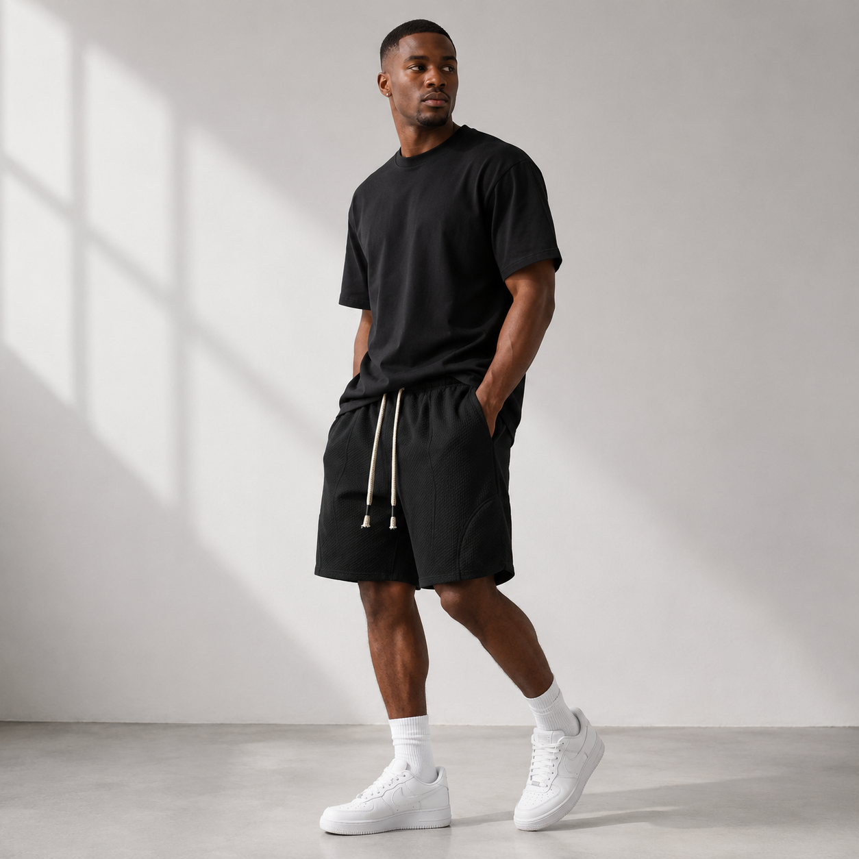 Black Drift Easy Shorts styled on a male model