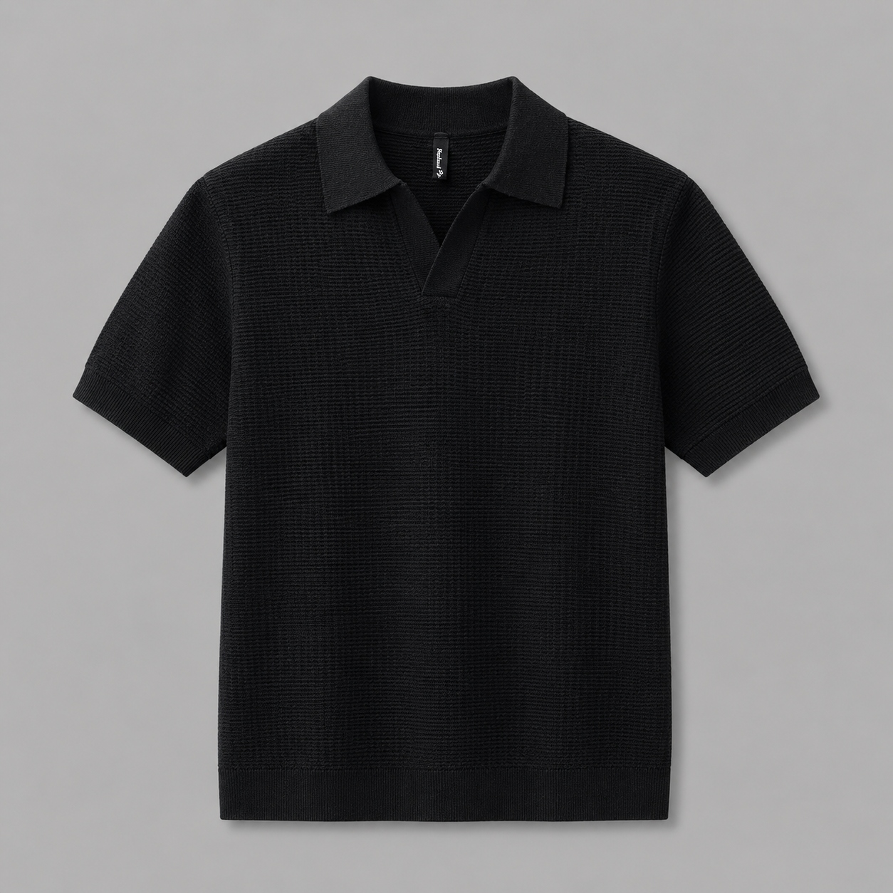 Black Ivy Knitted Polo, front view on neutral gray background