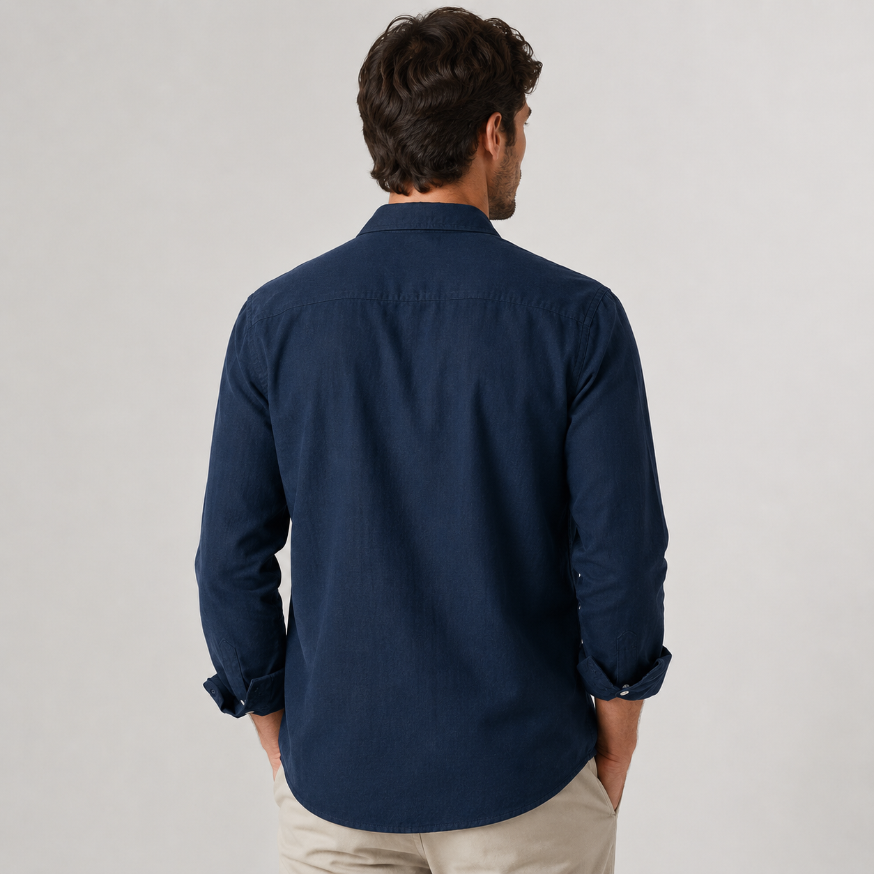 Model wearing the Osaka long-sleeve shirt in dark blue — back view